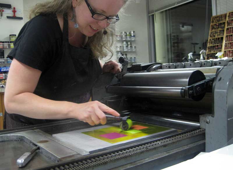 Click the image for a view of: Jessica, inking up at the letterpress!